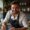 Zac A., a passionate food creator, smiling while preparing a fresh homemade dish in a cozy kitchen.