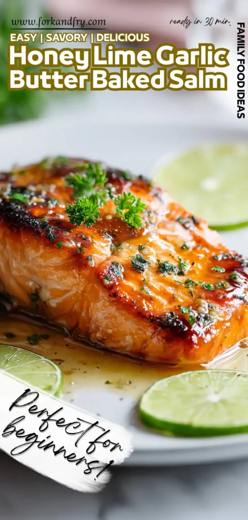 Close-up of baked chum salmon glazed with garlic butter, lime slices, and fresh herbs on a white dish.