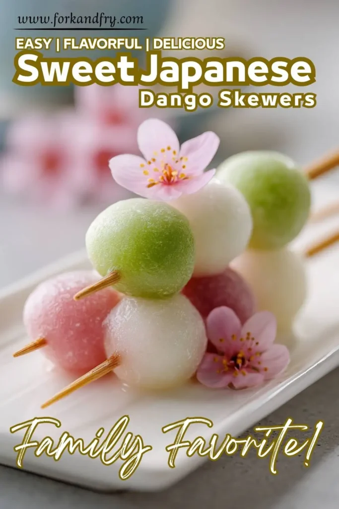 Japanese sweet dango on skewers Soft pink, green, and white dango balls on skewers, plated for dessert