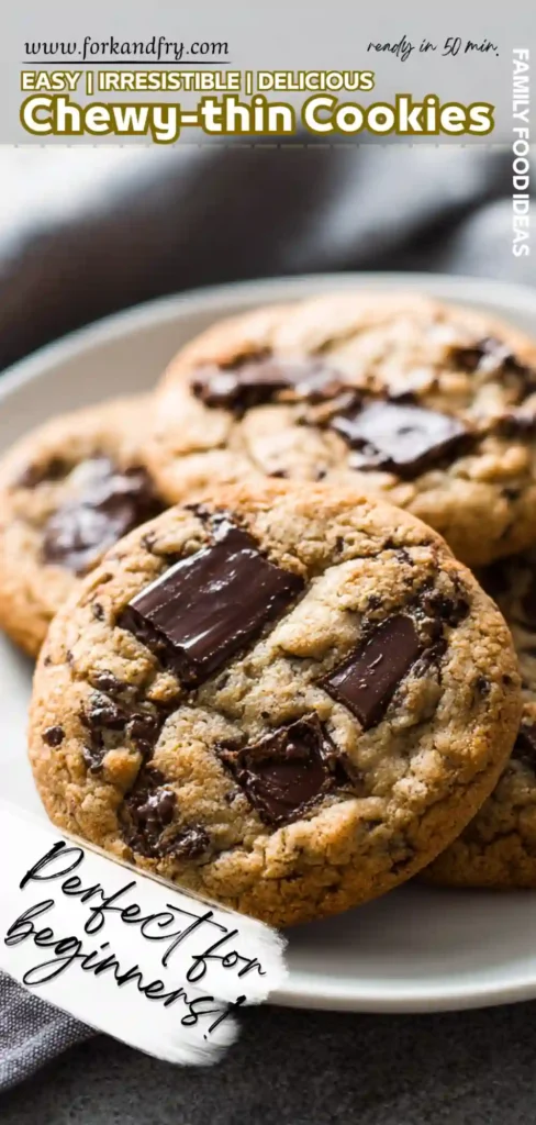 Crispy Edge Gooey Centre Chocolate Chunk Cookies Plate of thin crispy‑edge chocolate chunk cookies baking tray in background