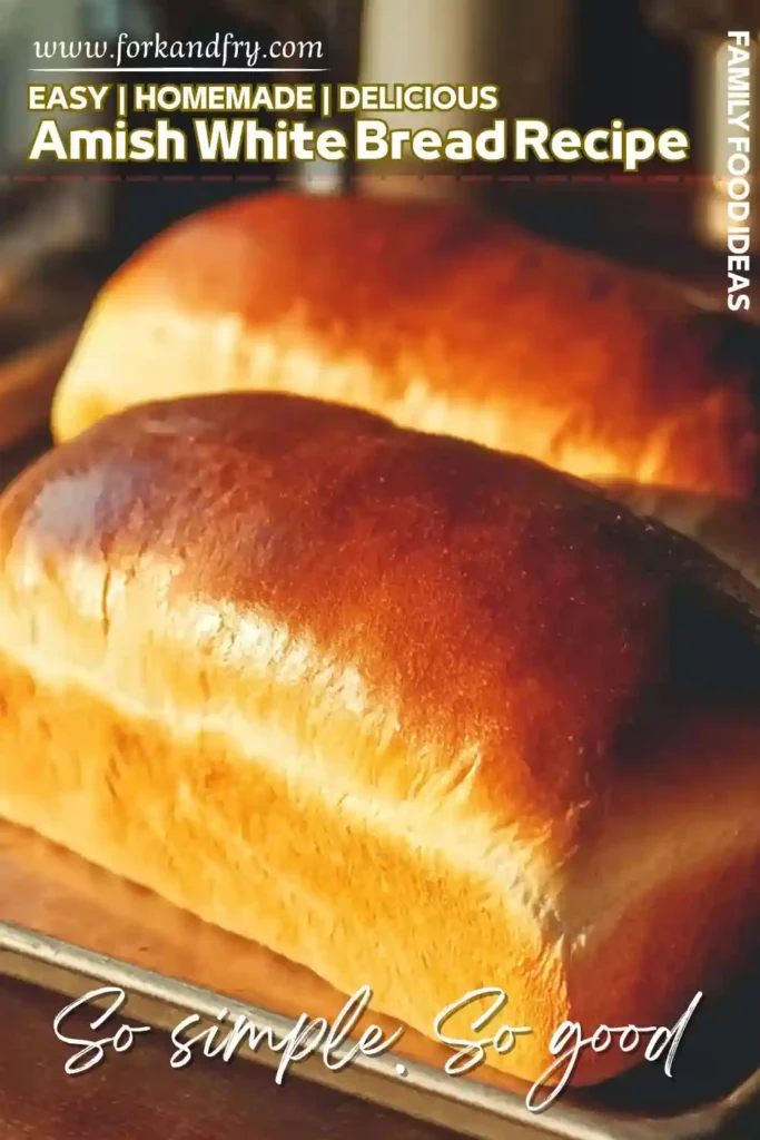 Homemade Amish White Bread with Golden Crust freshly baked amish white bread loaves on a tray with golden brown crust
