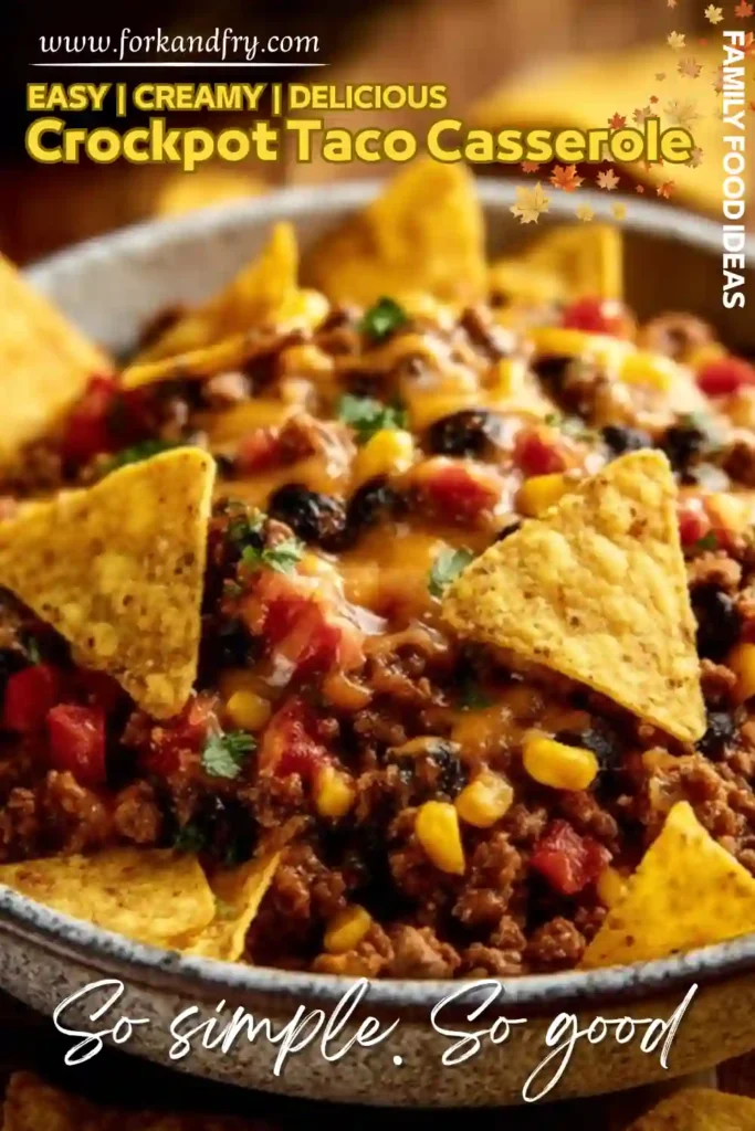 creamy crockpot taco casserole with ground beef, corn, black beans, tomatoes, cheese, and tortilla chips