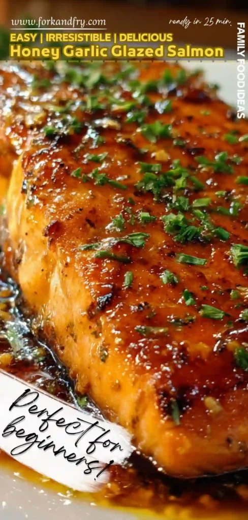 Honey Garlic Glazed Salmon Fillet Recipe close up vertical image of honey garlic glazed salmon fillet topped with herbs