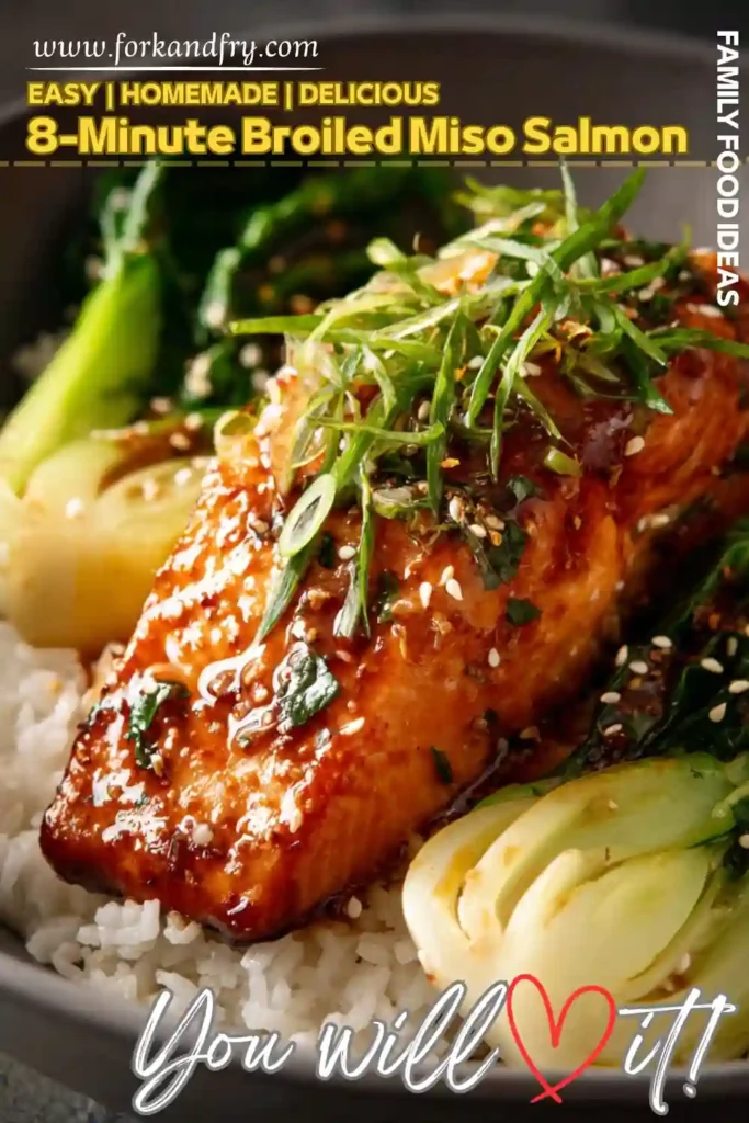 8 minute broiled miso salmon with bok choy and rice glazed miso salmon fillet over steamed rice with bok choy sesame seeds and scallions in a black bowl