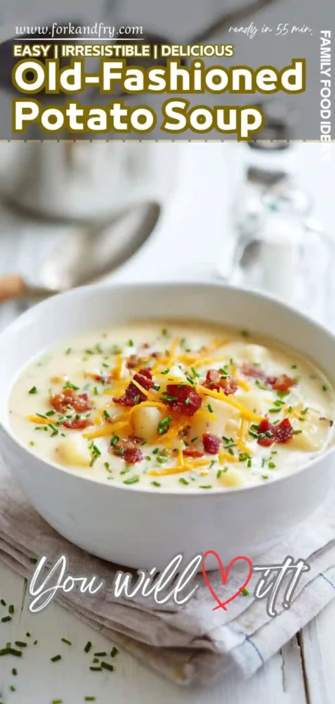 creamy old-fashioned potato soup with bacon, shredded cheddar, and chives in a white bowl