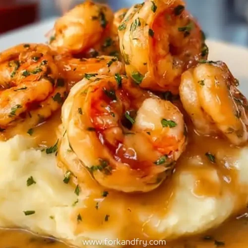 Garlic butter shrimp over mashed potatoes with brown gravy