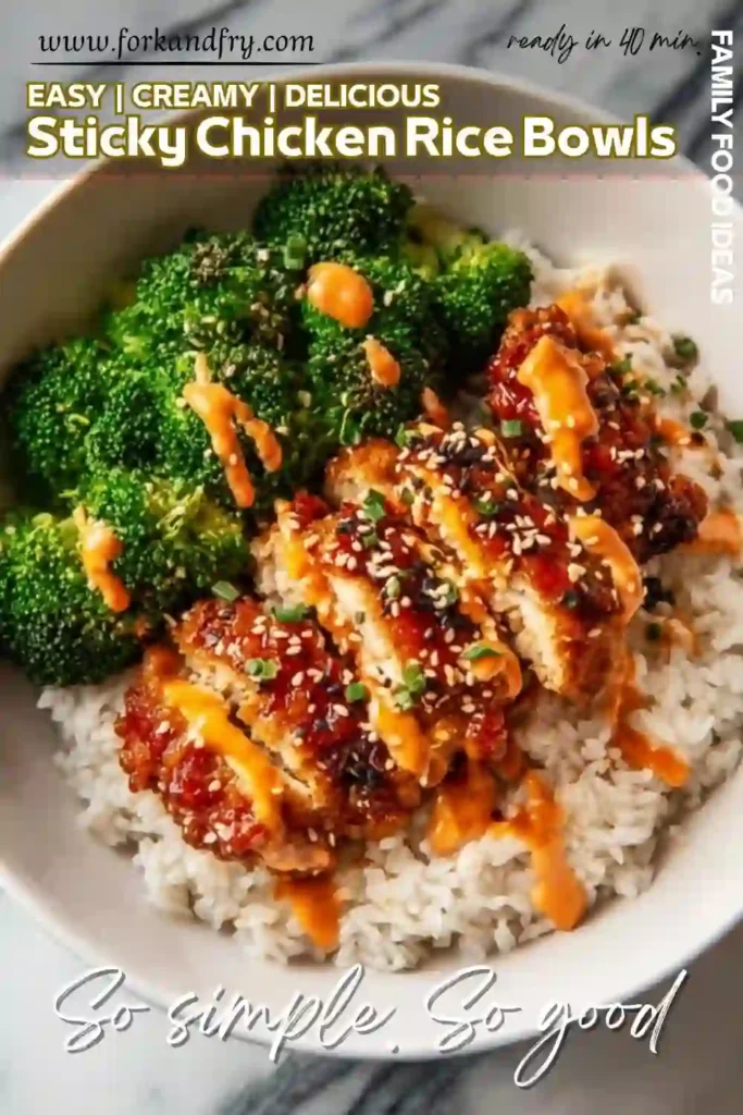 Sticky Chicken Rice Bowls – Creamy, Spicy, and Ready in 40 Minutes Sticky chicken rice bowl with broccoli, sesame seeds, and spicy mayo drizzle in a white bowl over marble surface
