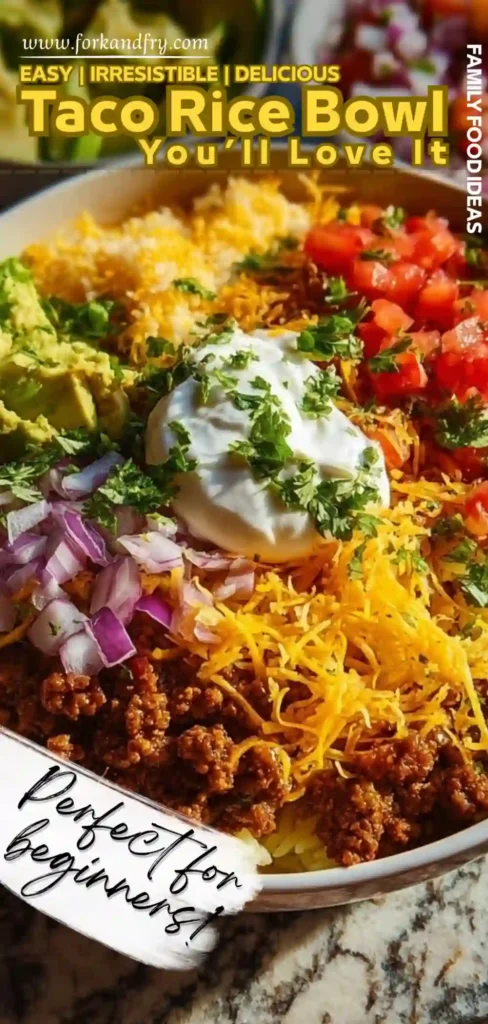 loaded taco rice bowl with seasoned beef, shredded cheese, sour cream, guacamole, and fresh vegetables