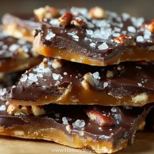 Crunchy saltine toffee bark topped with rich chocolate, pecans, and sea salt