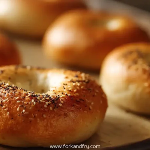round golden greek yogurt bagels topped with sesame and poppy seeds