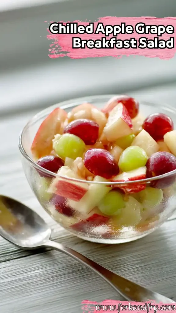 Chilled Apple Grape Salad Perfect for Light Breakfasts Chilled apple and grape salad in clear bowl with red and green grapes, served on wood with spoon and text overlay