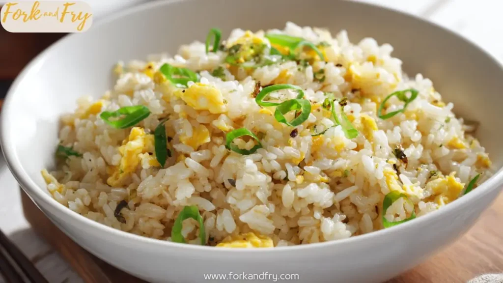 bowl of Japanese hibachi fried rice with egg and chopped green onions