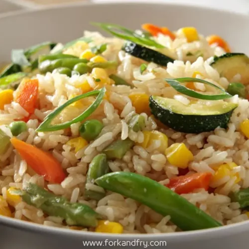 colorful hibachi vegetable fried rice with zucchini, peas, carrots and green onions