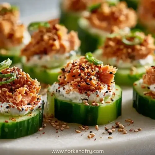 tuna cucumber bites topped with everything bagel seasoning and cream cheese