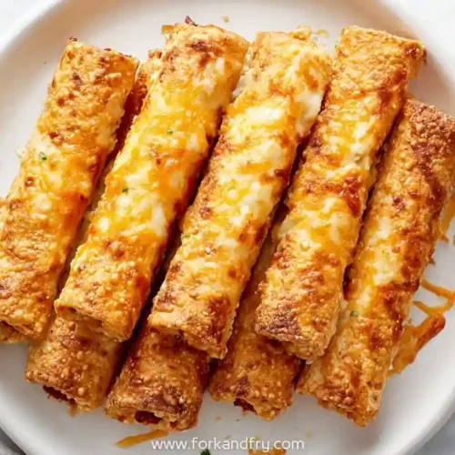 Crispy cheesy taco sticks stuffed with seasoned ground beef served with salsa and sour cream dip