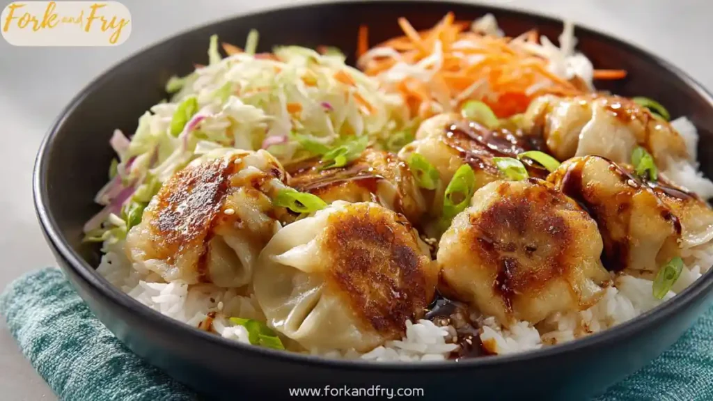Crispy Chicken Dumpling Bowls (Easy Weeknight Idea) 1 Crispy chicken dumpling bowl with pan fried dumplings, white rice, coleslaw, and green onions